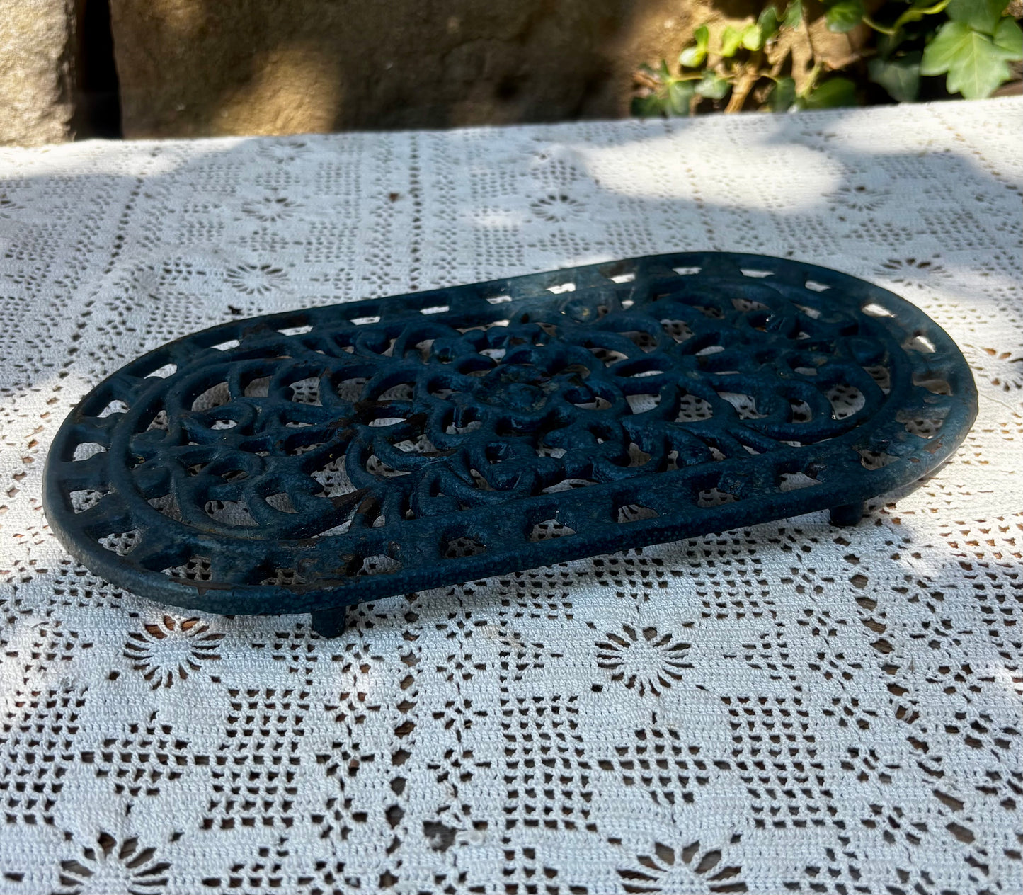 Dessous de plat en fonte